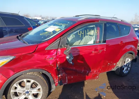 2016 Ford Escape Titanium z USA, uszkodzony, nr VIN 1FMCU0JXXGUC54620